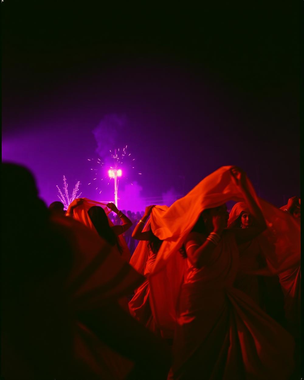 Dancers in flowing fabric at a night cultural celebration